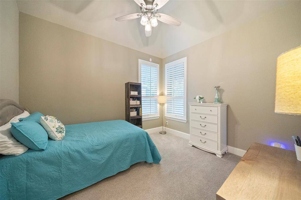 Secondary bedroom on back of the home features walkin closet and its own full bathroom.
