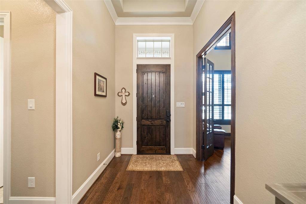 Grand foyer with 8 ft doors throughout the home.