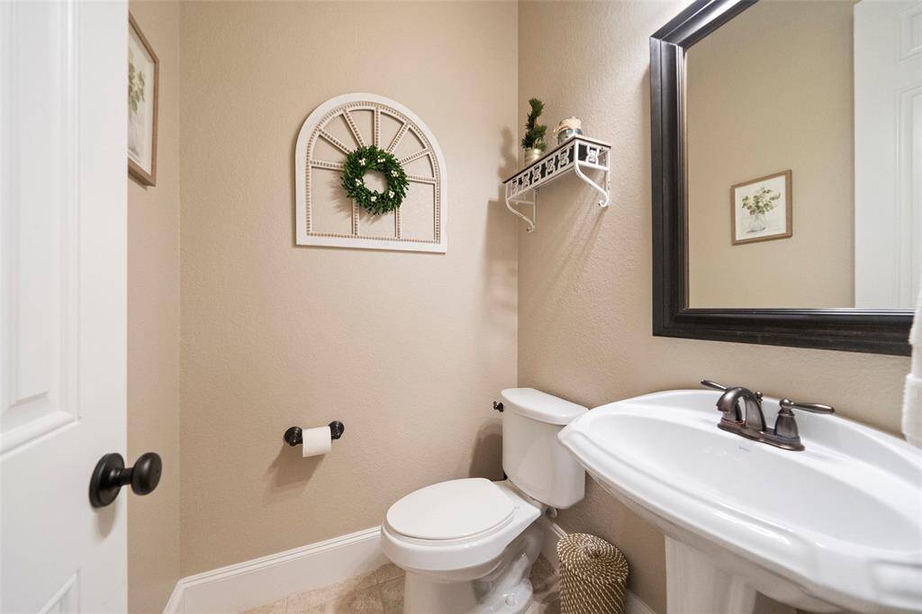 Guest powder room off of grand hallway.