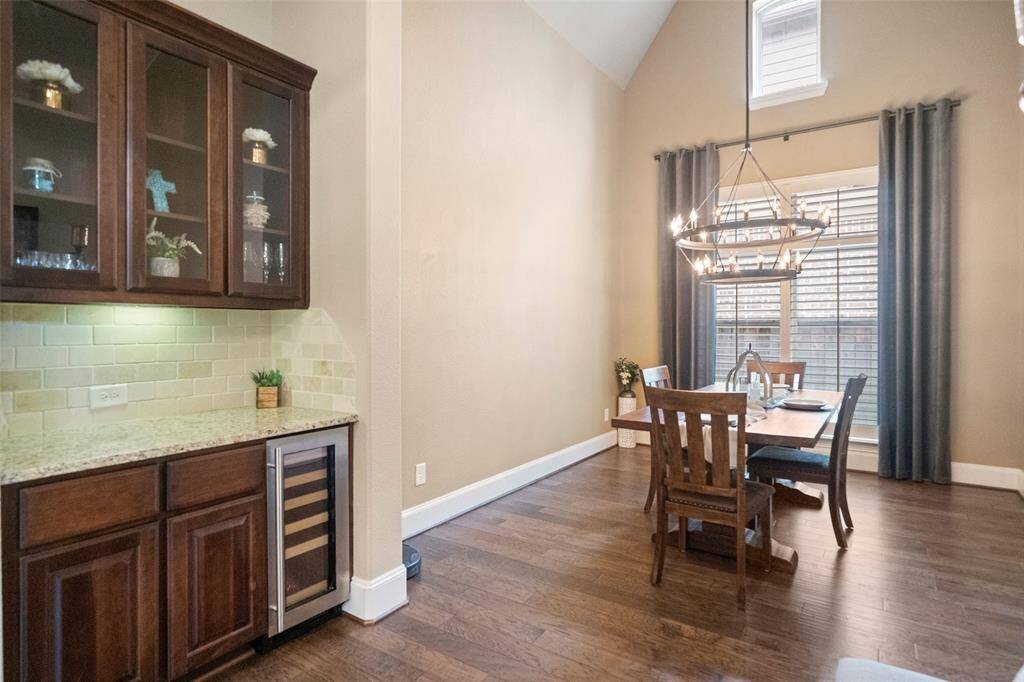 Dining room has a wine cooler & dry bar.