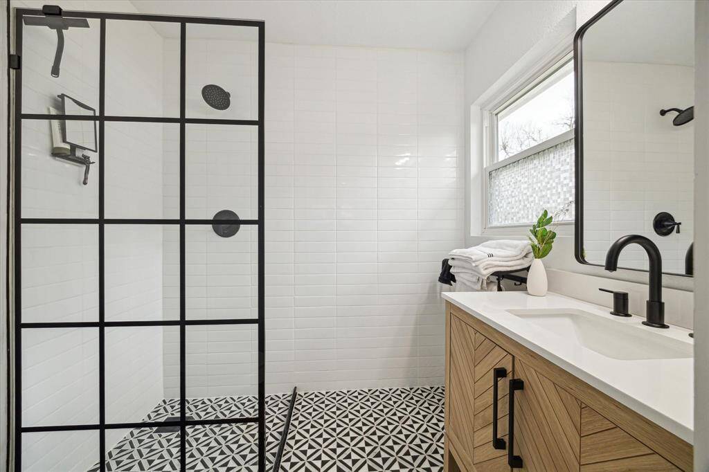 Beautifully renovated, modern primary bathroom.