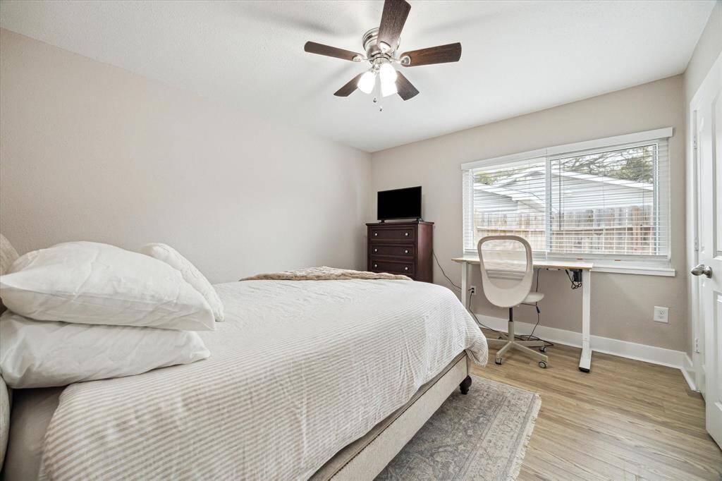 Secondary bedroom 1.  There are two closets and plenty of space to accommodate a work space.