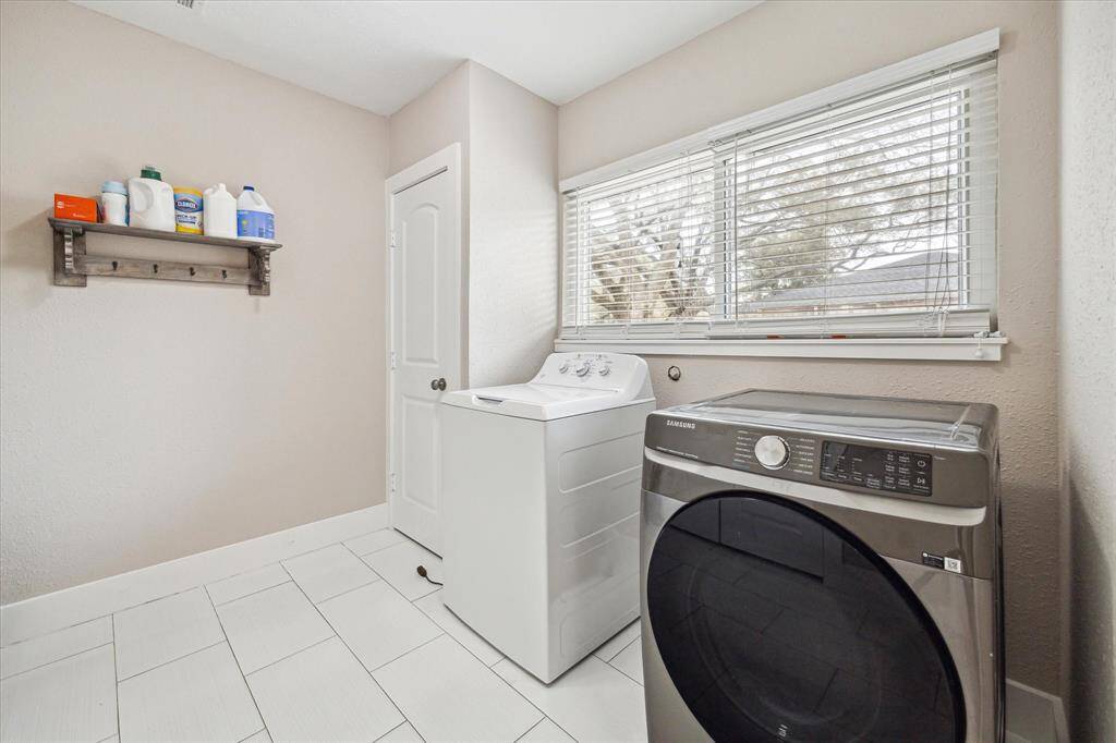 To the right after entering the home there is an large laundry room with 2 storage closets and a full pantry!