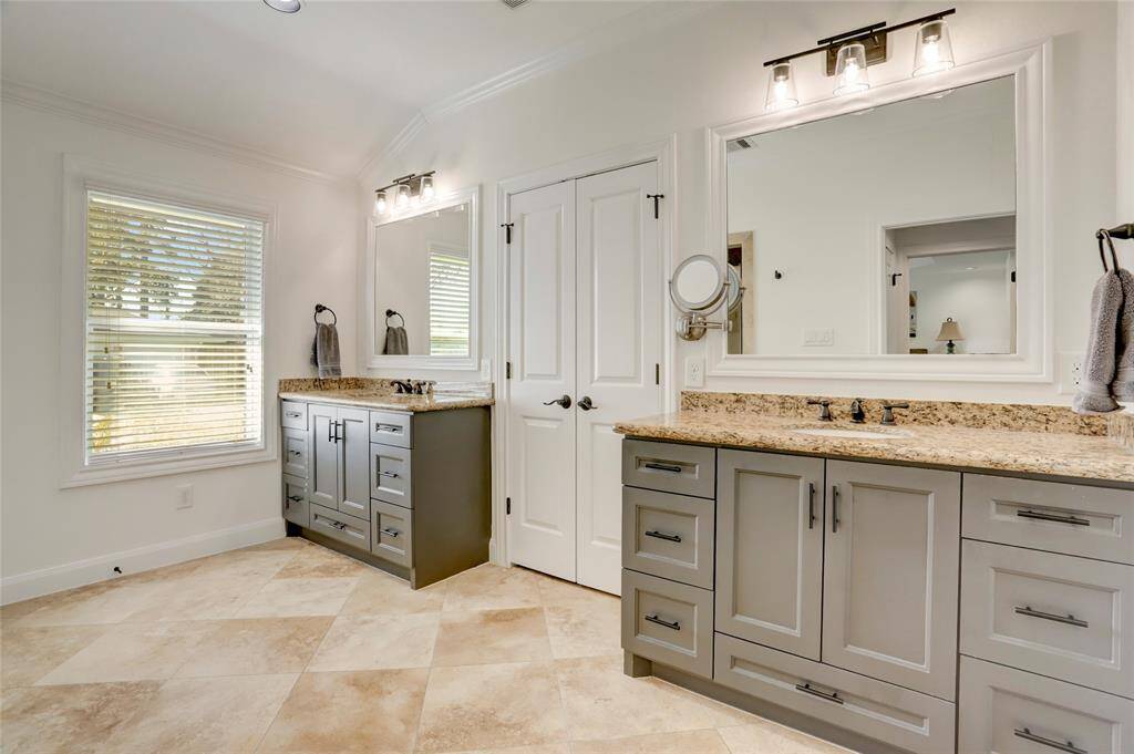 The primary bathroom offers dual vanities, toilet closet, and walk-in shower. Photos of the primary closet coming soon.