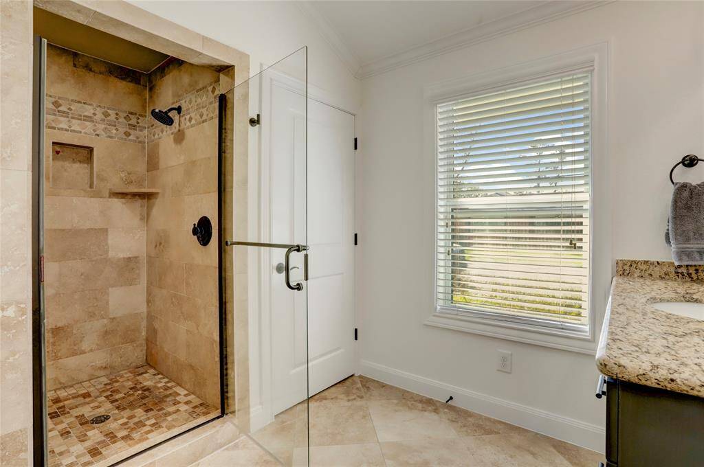 View of the primary shower and toilet closet.