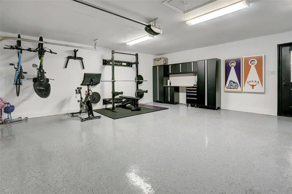 The large garage offers plenty of parking space as well  the option for a home gym. The attached storage will convey with the home and mounted workout equipment is negotiable.