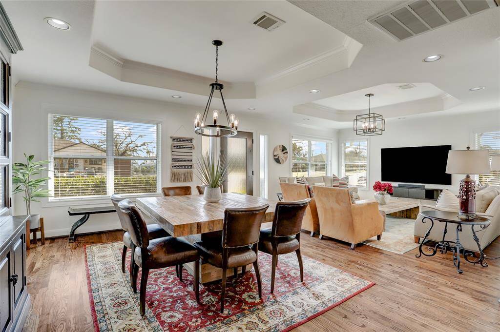 View toward the front door from the edge of the kitchen. Notice the corner walls with seven windows between the living and dining rooms.