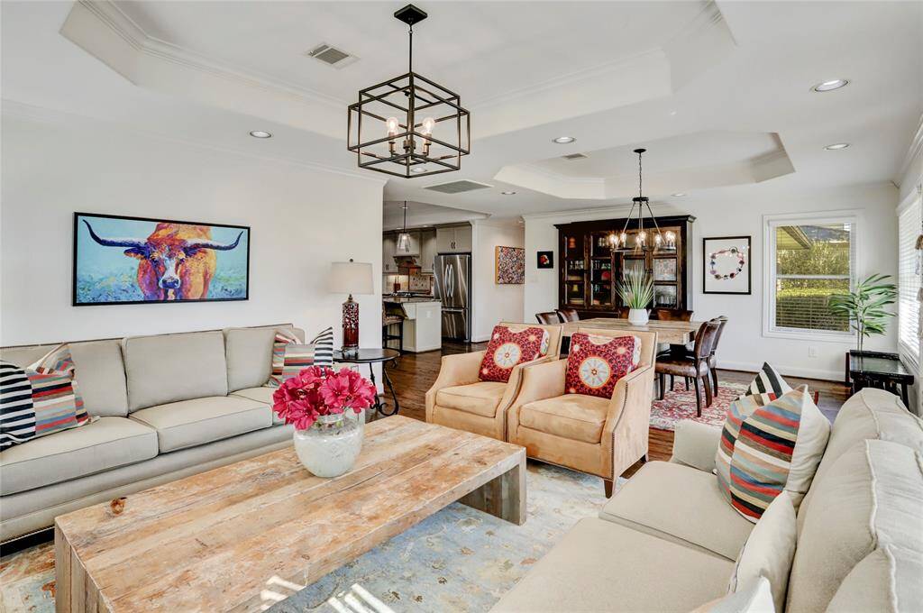 The sizable living room offers space for multiple couches and various furniture layouts.