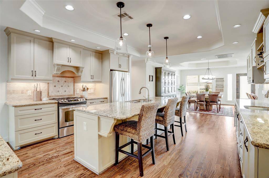 View of the kitchen from the entrance to the primary suite.