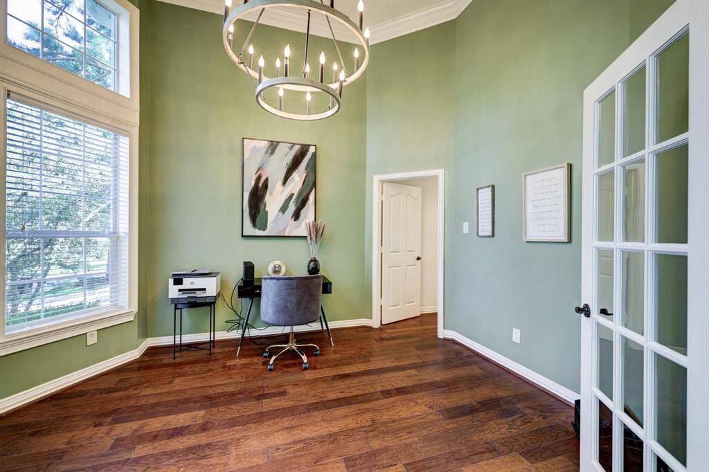 A work-from-home space you have been dreaming of!  Huge windows, new lighting, soaring ceilings, French doors that provide privacy for working from home, beautiful gleaming hard wood floors, painted a soft sage which is a color that calms your soul.