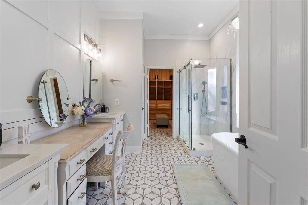 A entry view from the master bedroom into the renovated master bathroom straight out of a magazine.