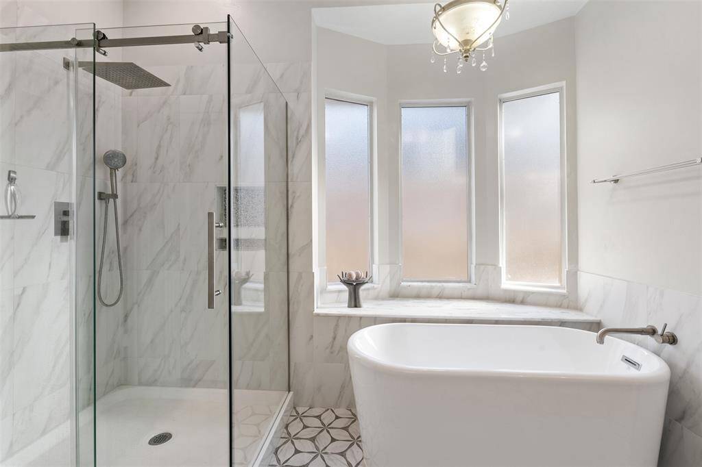 Soaking tub, separate shower, updated tile floors, upgraded lighting and more.
