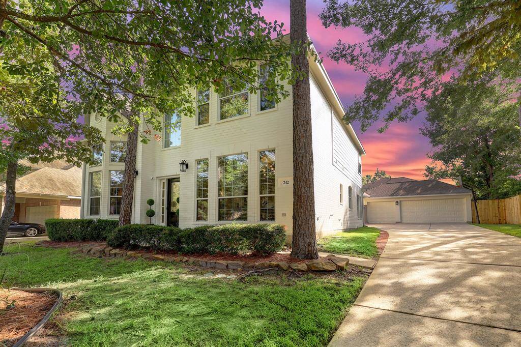 From the street, you will notice the painted white brick which adds modern touches to this traditional 2-story home.