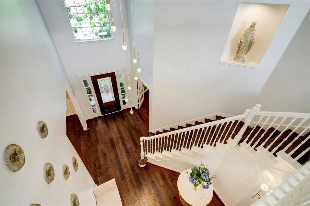 Second floor view of the grand staircase and front foyer