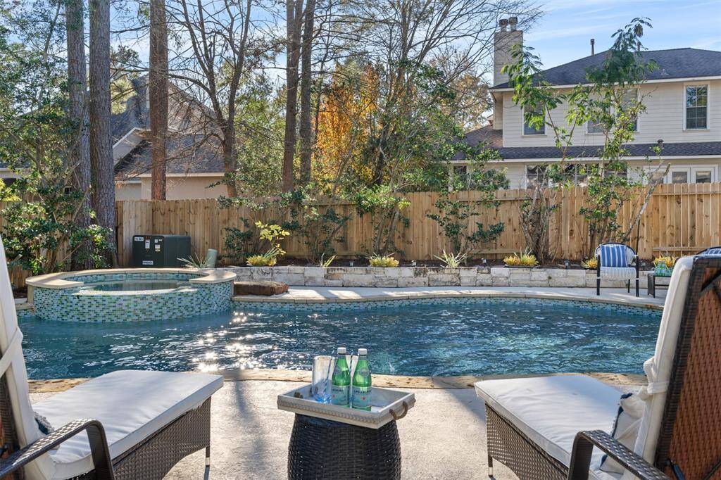 The star of this show is the premier outdoor space and heated saltwater pool, space, covered patio, and fully fenced backyard with room for gardening.
