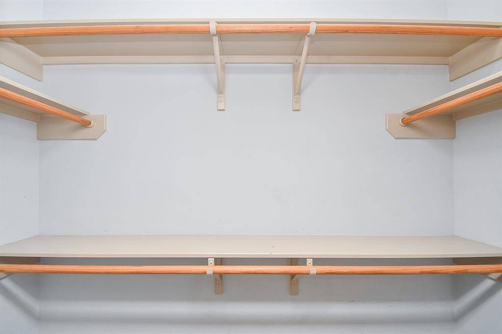 one of the 2 primary bedroom closets