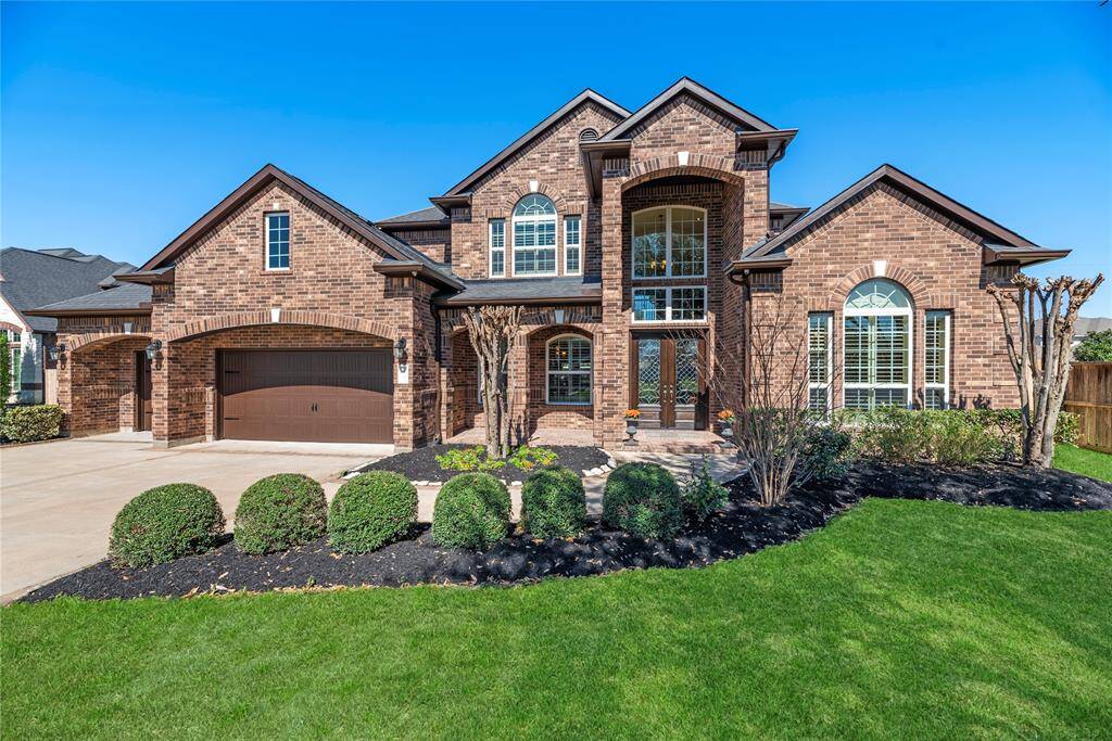 Welcome home to 25302 Cherry Ranch Drive nestled in the prestigious Katy Creek Ranch community!