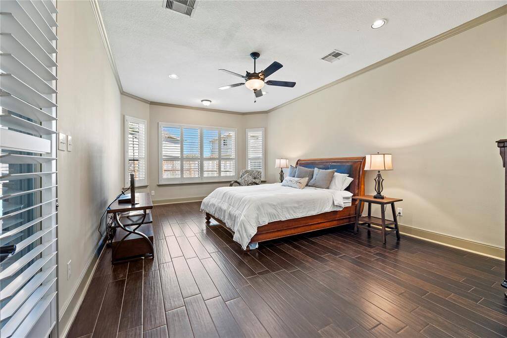 How perfect is this primary suite? Spacious and filled with natural light, this serene retreat offers the ultimate escape, promising comfort, tranquility, and pure relaxation.