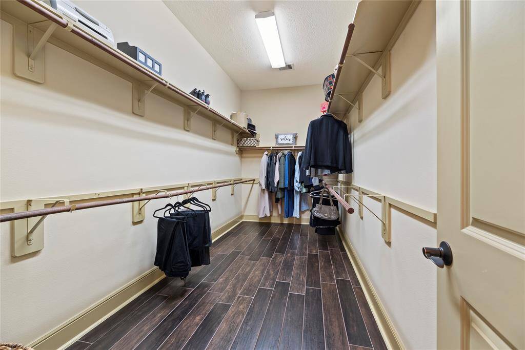 The primary closet provides generous space to store your entire wardrobe while keeping everything neatly organized and easily accessible.