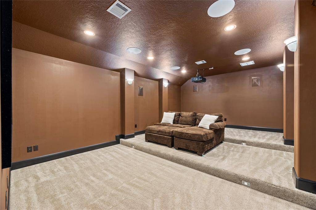 The media room is perfect for family movie nights. Prewired for surround sound and projection ceiling mount.