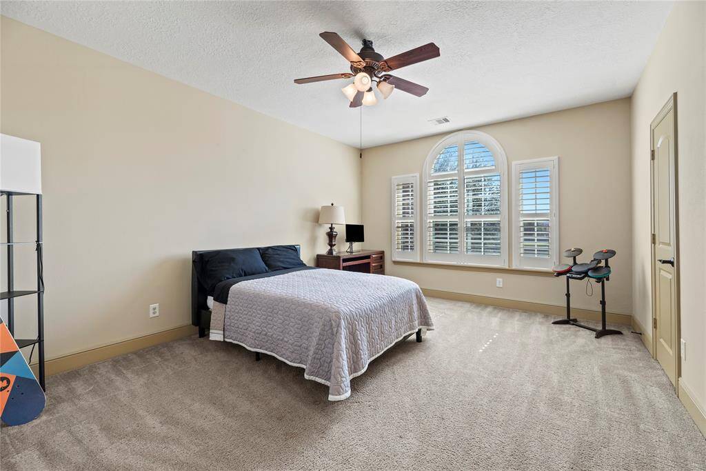 The thoughtfully designed layout of the third bedroom allows for natural light to flood the room, creating a warm and welcoming atmosphere, with private en-suite bath.