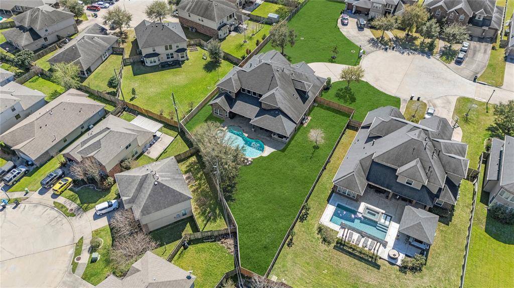 From this aerial view of the back of the home, you can fully appreciate its beauty, elegance, and remarkable charm.