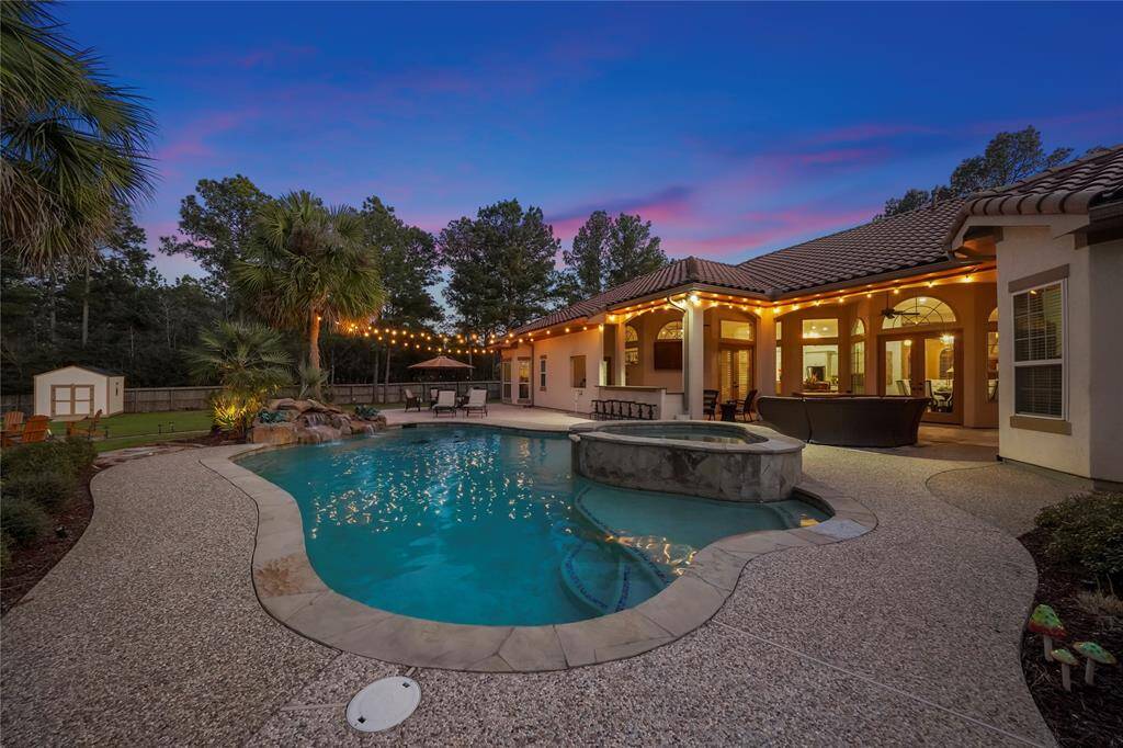 This stunning luxury home has so much to offer, including an in-ground pool with an elevated spa alongside an outdoor kitchen Lush landscaping surrounds the pool, further enhancing the privacy this oasis offers.