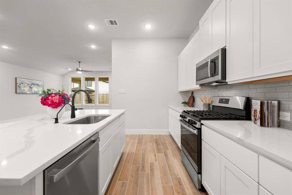 Quartz countertops, and top-of-the-line stainless steel appliances.