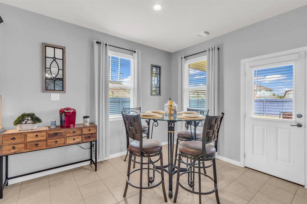 Dining room with great lighting facing the backyard
