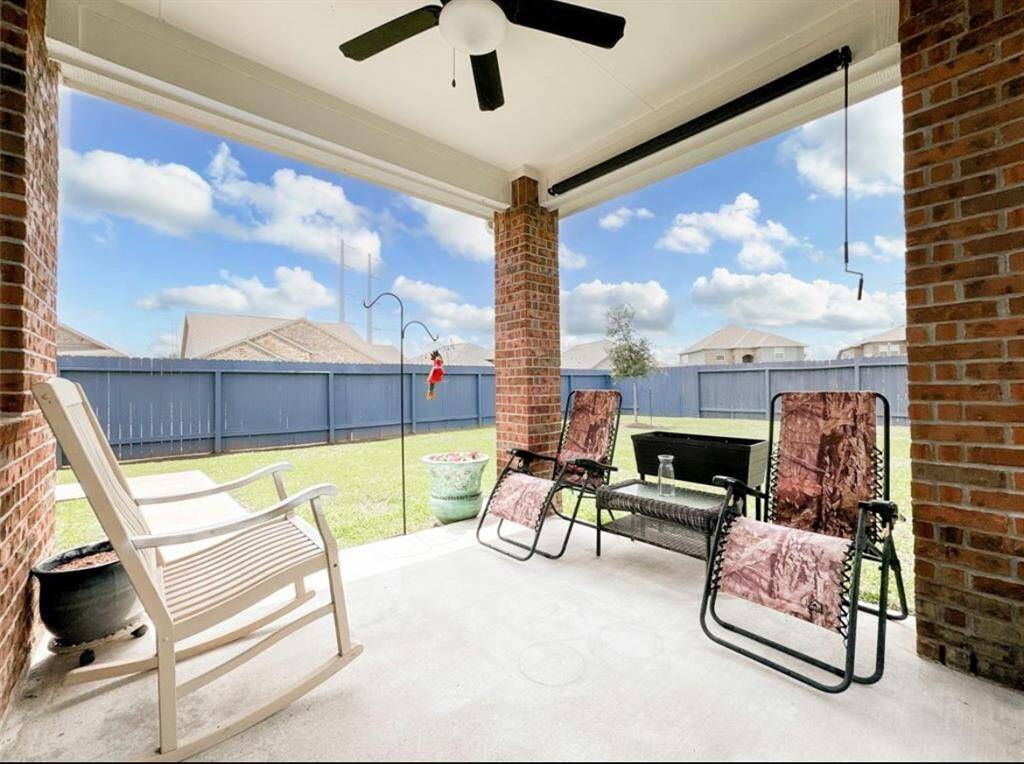 Beautiful covered patio with ceiling fan for the HOT Texas weather!