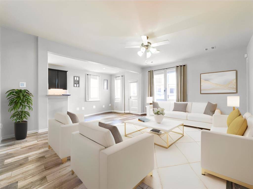 Virtually staged livingroom to show diversity within the livingroom space.