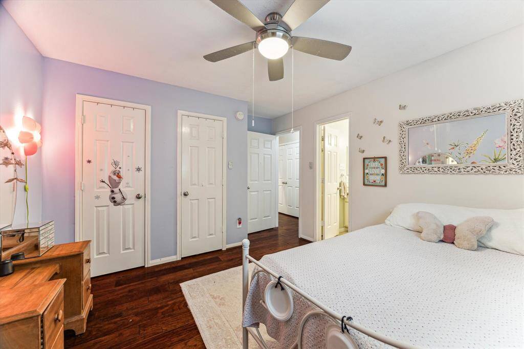 One of 3 secondary downstairs bedrooms with plenty of closet space and beautiful floors