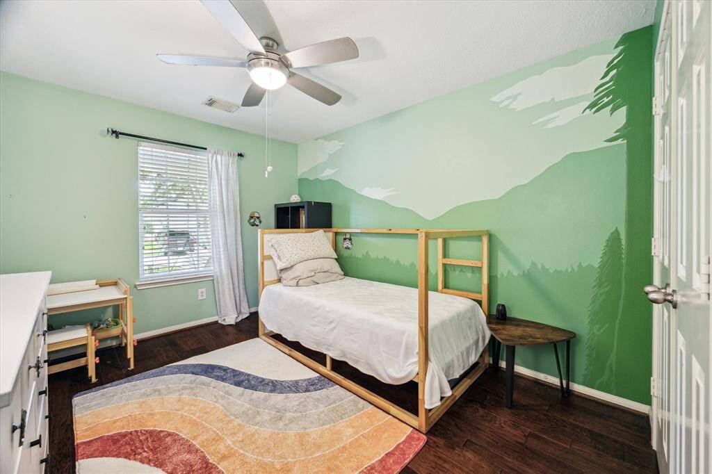 An colorful backdrop to one of 3 1st floor secondary bedrooms.  Such a great room.