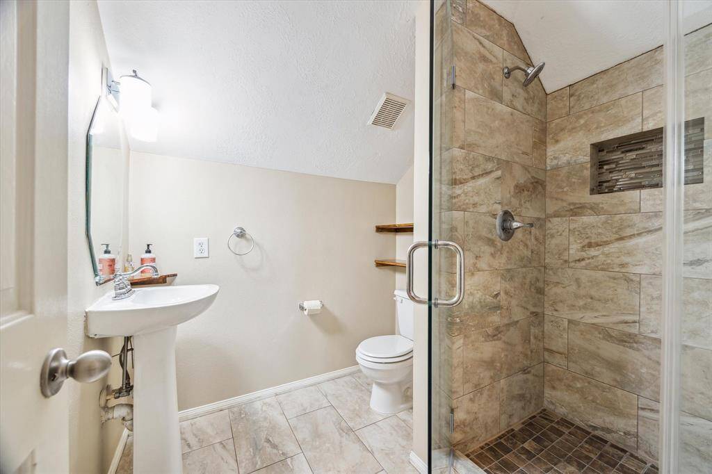 This updated walk in shower on the 2nd floor is the private bathroom of the bonus room.  Nice and spacious and great shower.