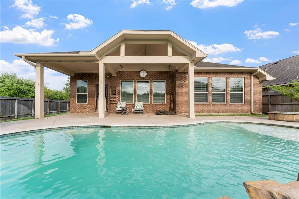 Relax under your covered porch and cool off in the private pool