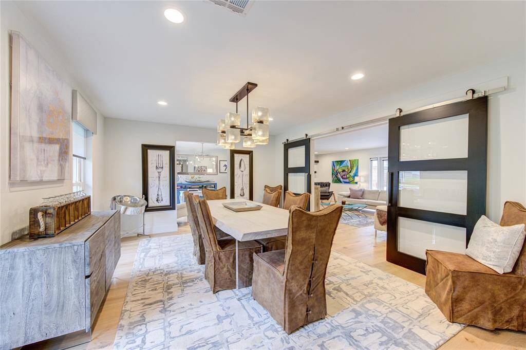The dining room was designed with versatility in mind--the double barn doors can either create an open entertaining space, or close for a more private setting.
