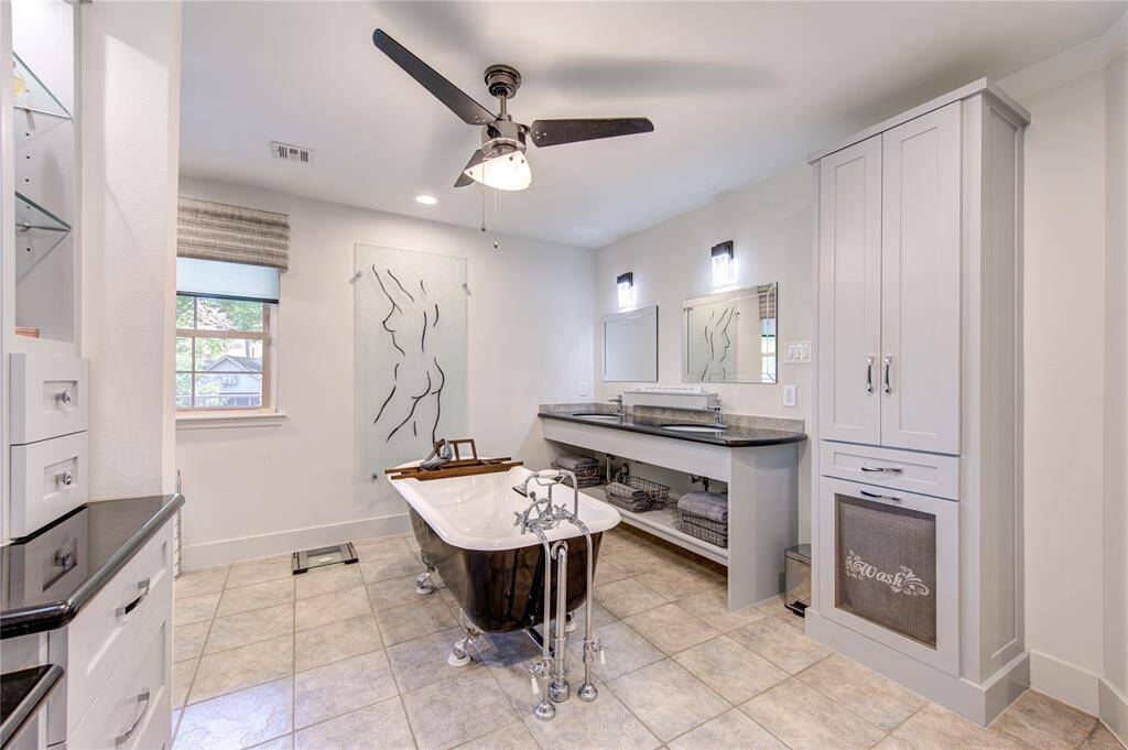 The recent Shaker cabinets were thoughtfully designed to offer organized storage for all of your bathroom essentials. Modern lighting and finishes tie in with the modern luxury found throughout this home.