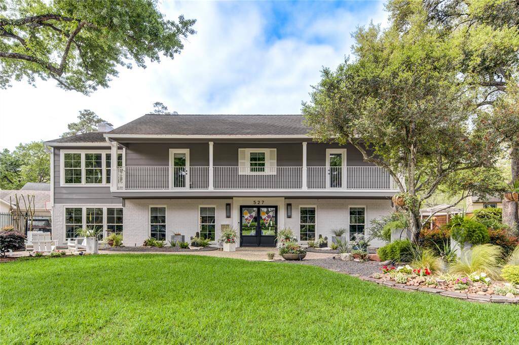 This home was won yard of the month multiple times with a modern xeriscape incorporated with an expansive green lawn and mature trees.