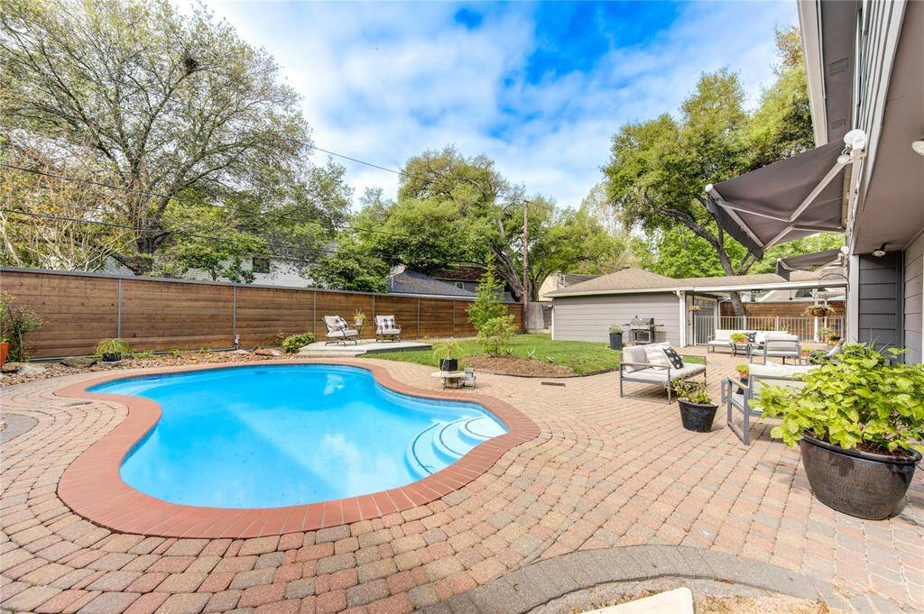 Cool off this summer in this sparkling private pool that was installed perpindicular to the home to take advantage of the pie shopped lot offering lots of green space in addition to the pool.