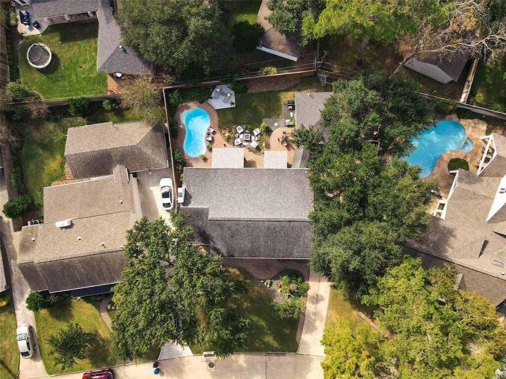 Showcasing a rare estate pie-shaped lot, a coveted find in this neighborhood. The expansive front yard enhances the home’s grand presence, while the double-wide backyard offers ample space for a pool, lush green space, and ultimate privacy.
