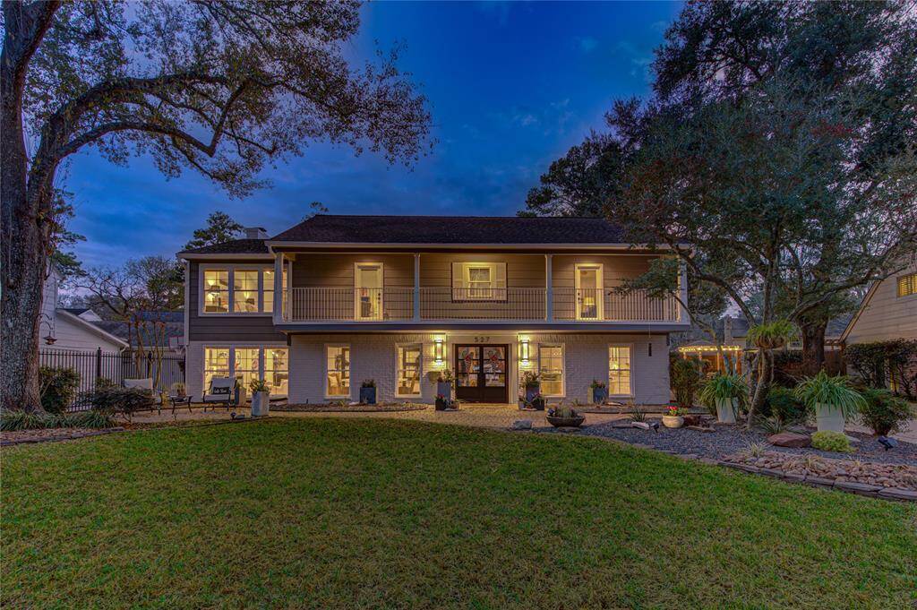 Dusk photo capturing the warm glow of this modern exterior.