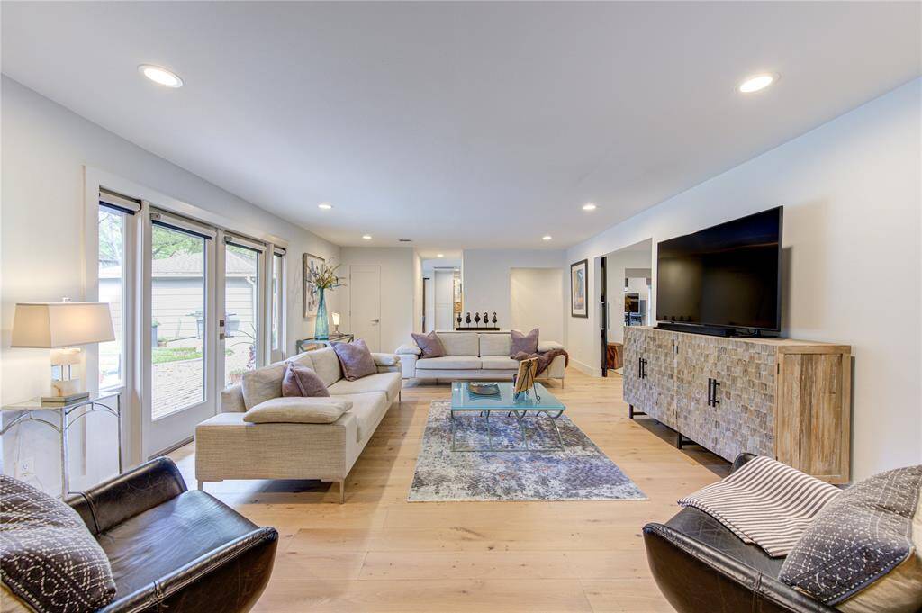 Another view of this super spacious Den that is just filled with natural light from the wall of windows and doors overlooking the back yard. 23X15 sf of space!