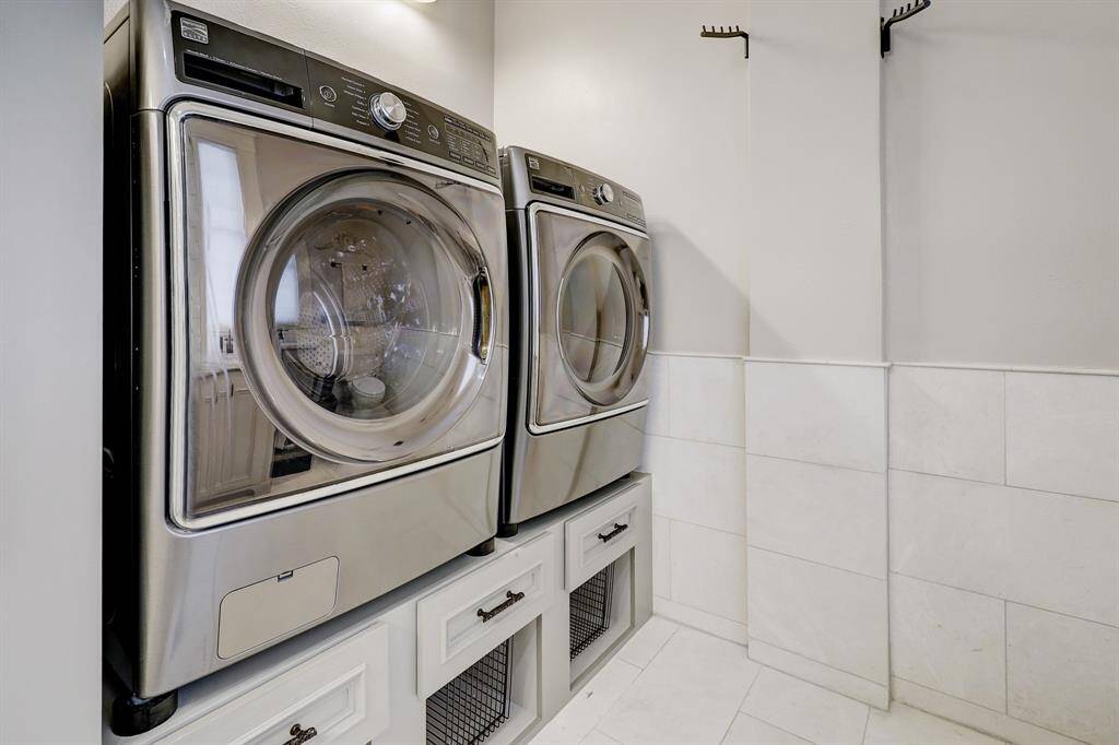 Well thought out laundry with storage space.