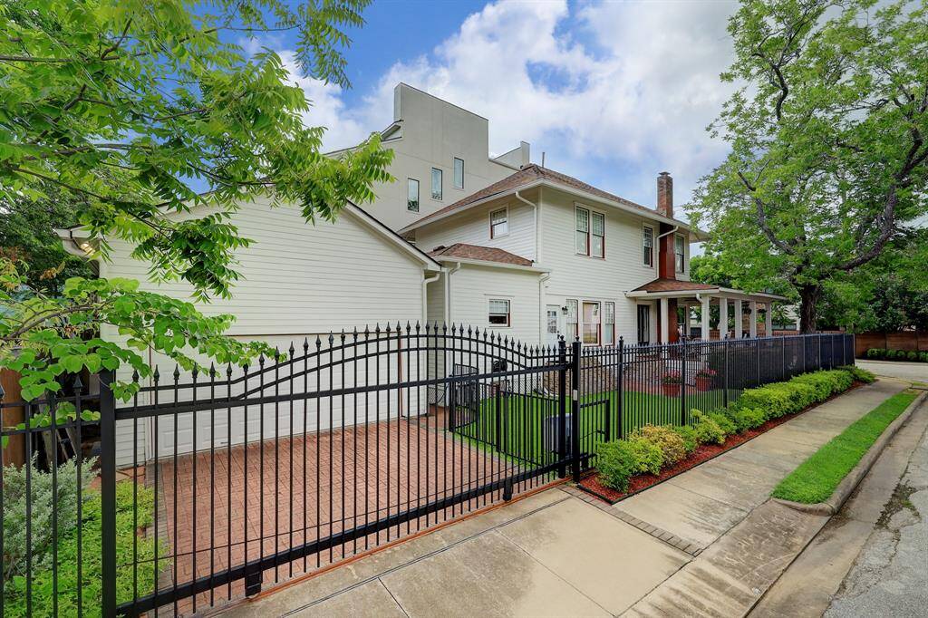 Notice the designer driveway as you enter your property through the automatic wrought iron gate.