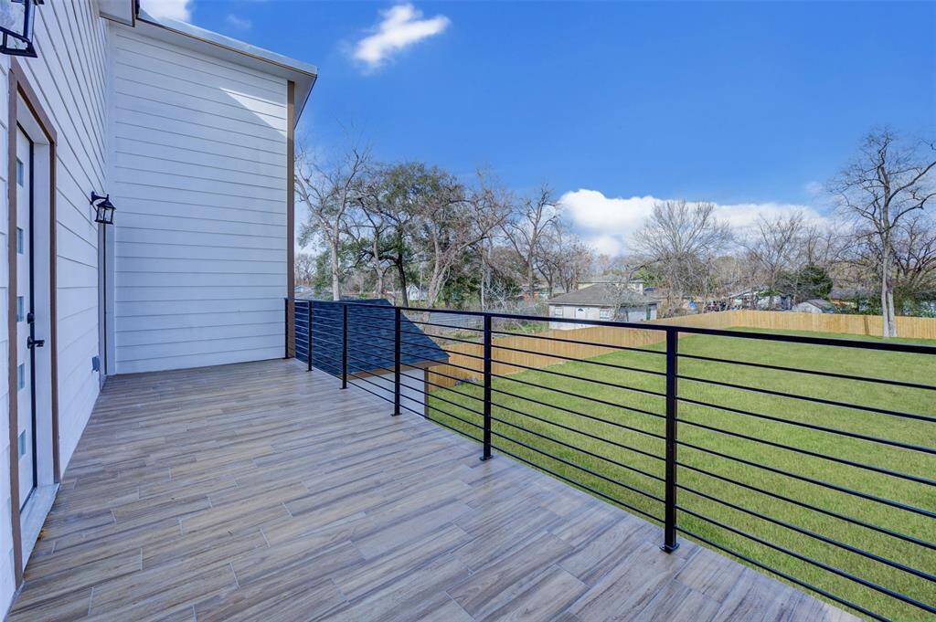 View from upstairs Patio of HUGE Backyard! Endless possibilities!! Add pool, tennis court, Extend patio, etc.