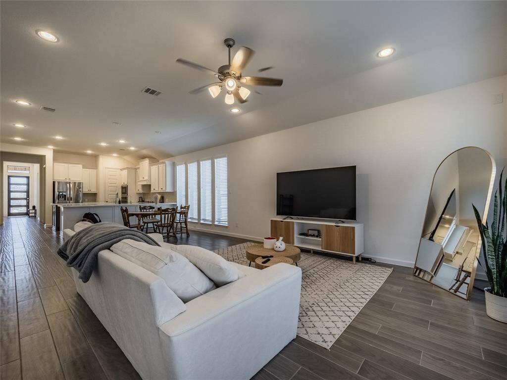 great family room, ceiling fan recessed lighting great for entertaining