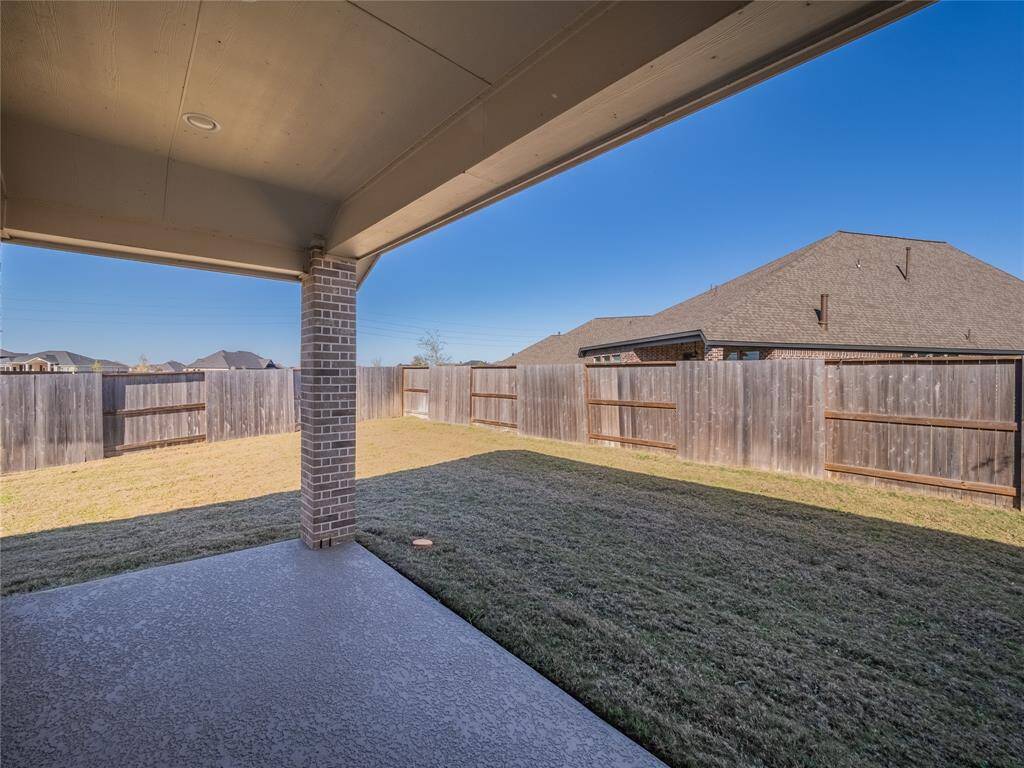 covered back patio with coated flooring