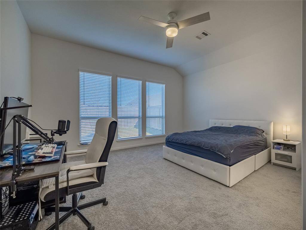 the primary is very spacious has the extra long windows ceiling fan barely used carpet is like new