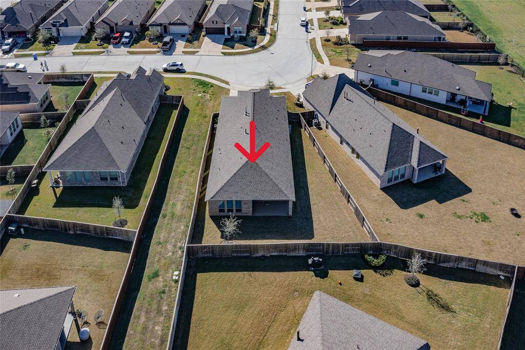 this is an aerial view showing the roof, the yard, the common area and your neighbors