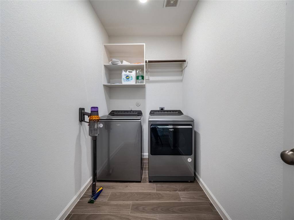 next is your laundry room has plenty of room storage and the washer and dryer stay with the sale of the home